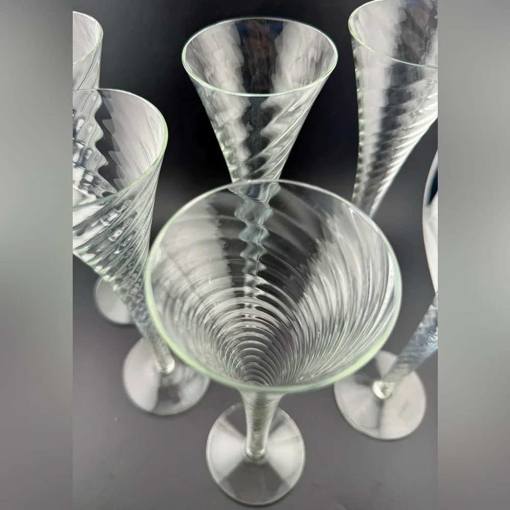 7 Crate & Barrel “Renoir” hollow stemmed champagne flutes. 6oz 10”H